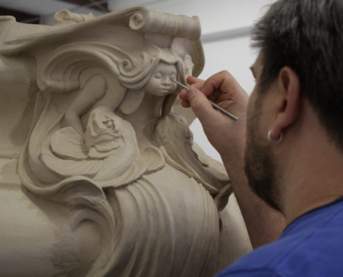 expertise_eros-fountain.jpg Sculptor doing detailed work on eros fountain replica