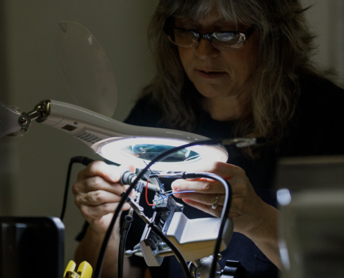 expertise_wiring-soldering-under-magnifying-glass.jpg